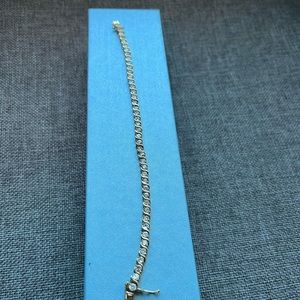 Custom jewelry tennis bracelet with stones 
Double clasp, gold color, Pre owned